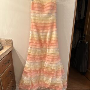 Sweet pastel ruffles strapless gown with rhinestone trim and crinoline